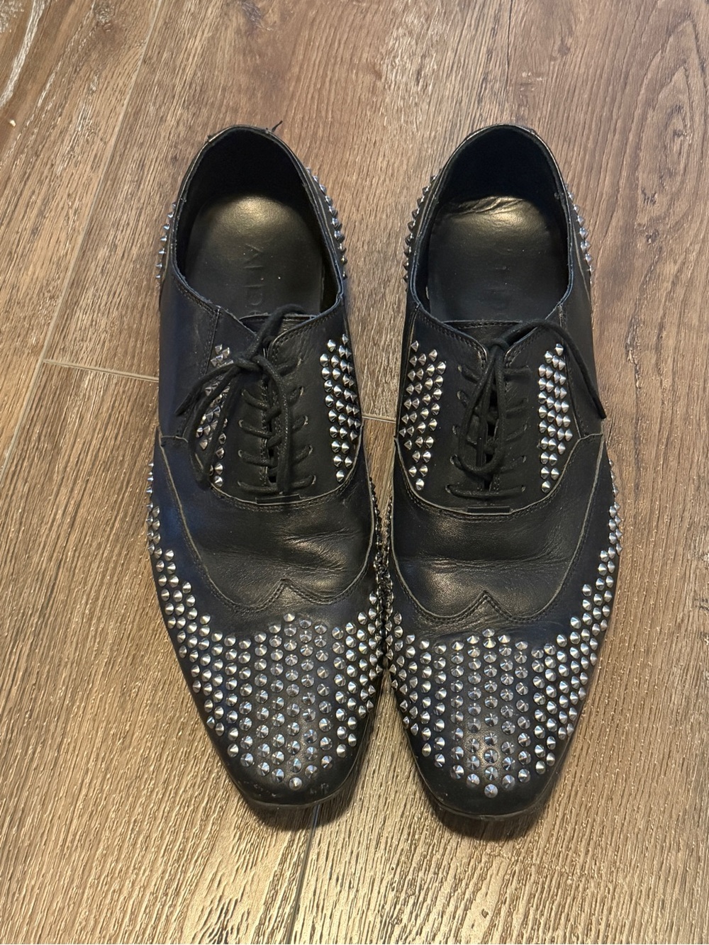 ALDO black leather studded Oxford dress shoes.